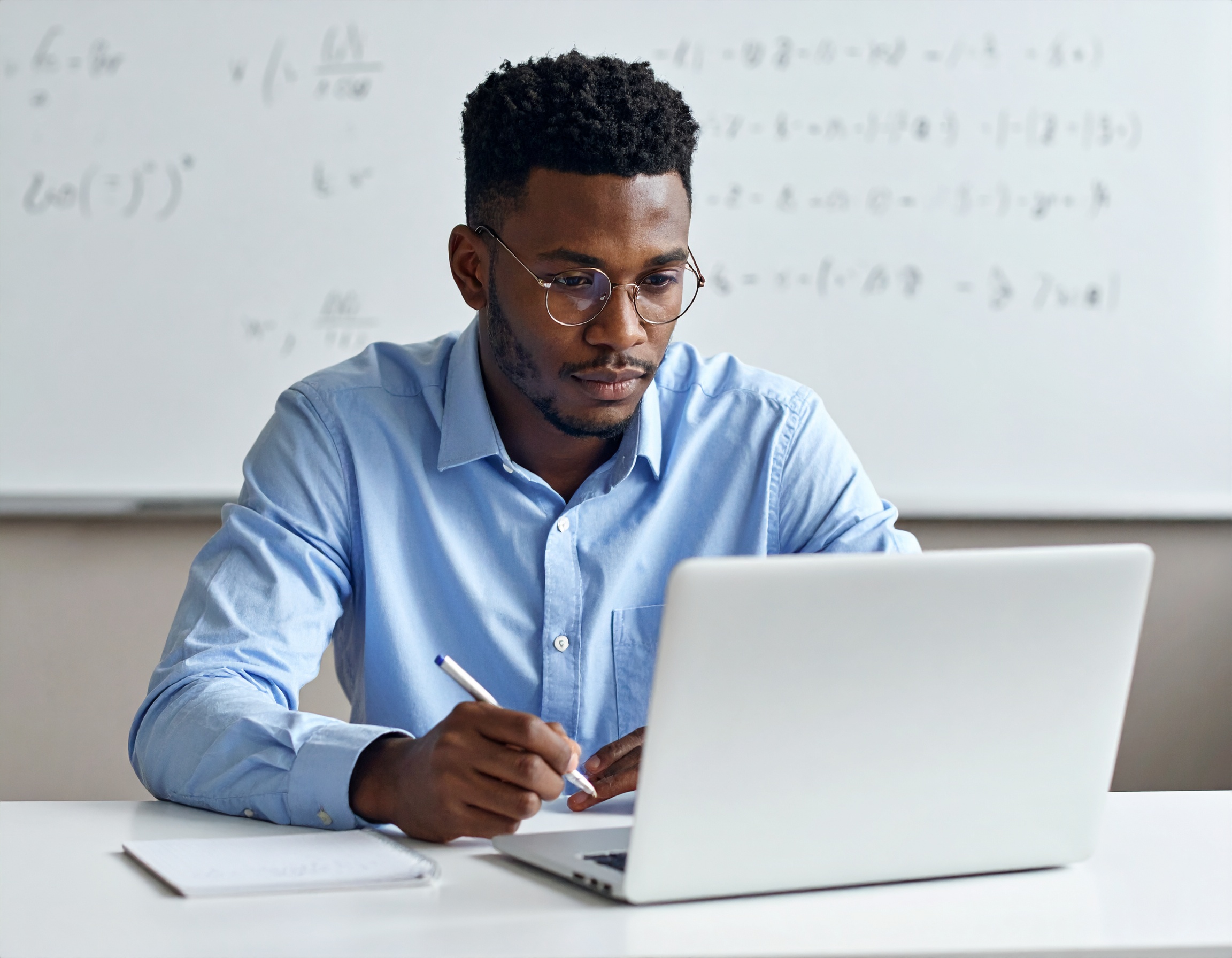 contact-img Firefly Handsome Young Light Skinned Black Male Taking Physics Exam With A Laptop With Many M 272251